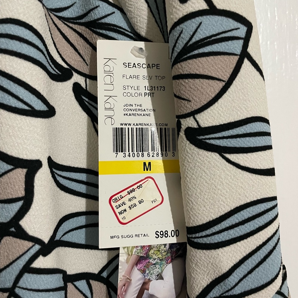 Karen Kane womens top. Floral / blue with nice sleeve detail. NWT